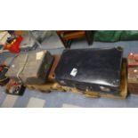 A Collection of Vintage Suitcases and Laundry Case