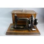 A Vintage Frister and Rossmann Sewing Machine in Inlaid Walnut Case