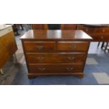 An Edwardian Mahogany Bedroom Chest of Two Short and Two Long Drawers on Bracket Feet, 107cm Wide