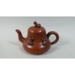 A Chinese Yixing Teapot with Applied Frogs to Body and Lotus Leaf Lid with Frog Finial. Seal Mark to