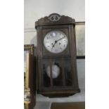 An Edwardian Oak Wall Clock