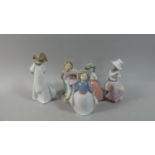 A Collection of Four Plus One Nao Figural Ornaments