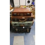 A Collection of Four Various Vintage Suitcases