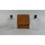 A Leather Cased Pair of Glass Flasks by Harrods, London, 12cm High