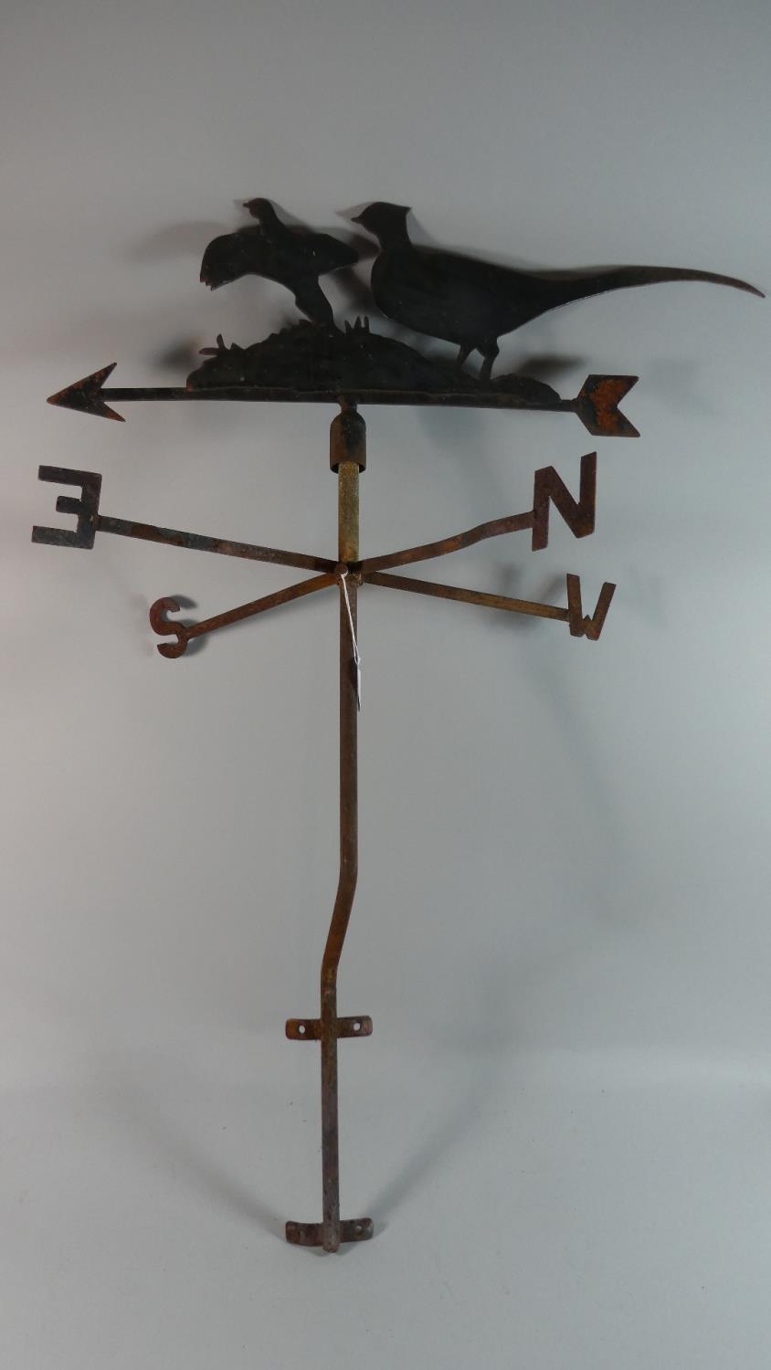 A Fret Cut Metal Weather Vane Decorated with Cock Pheasants on Tubular Wall Mounting Support