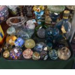 A Tray of Coloured Glassware to Include Ship in a Bottle, Decanters, Paperweights, Silver Topped