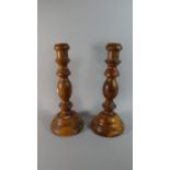 A Pair of Turned Wooden Candlesticks, 33cm High