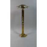 An Art Nouveau Brass Door Porter, 51cm High