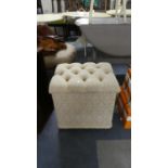 A Button Upholstered Box Stool Containing Floral Table Lamps