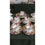 A Part Noritake Red and Gilt Tea Set Comprising Five Trios, Cake Plate, Saucer and Side Plate