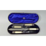 A Cased Set of Silver Banded Ivory Handled Carving Knives and Forks, Sheffield Hallmark by Joseph