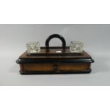 A Late Victorian Desktop Walnut and Ebonised Inkstand with Two Glass Ink Bottles, Carrying Handle