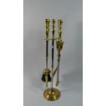 A Brass and Polished Steel Four Piece Long Handle Fire Iron Set, 54cm High