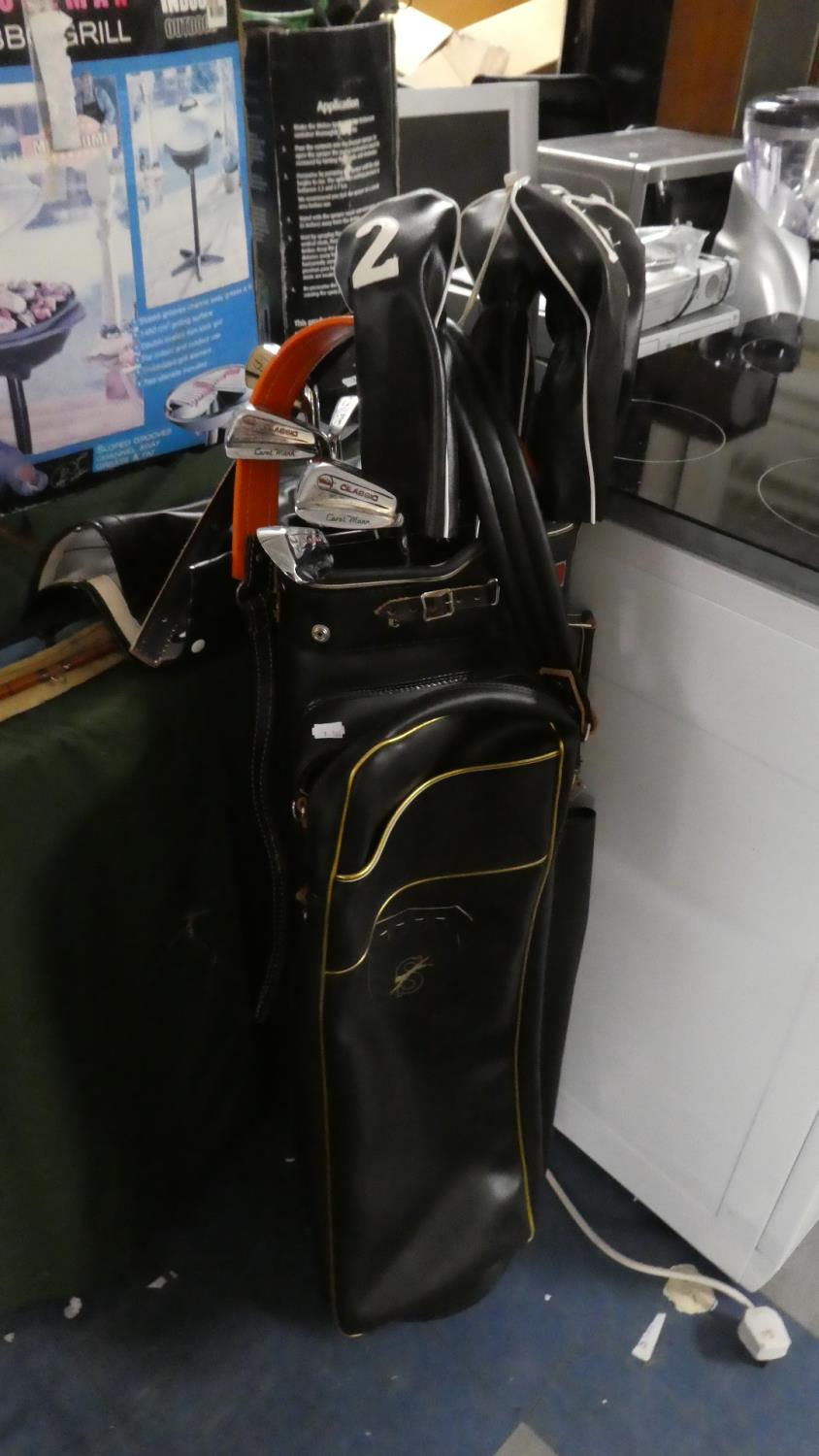 A Slazenger Golf Bag Containing Wilson Carol Mann Golf Clubs