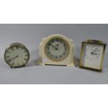 A Smiths White Bakelite Music Alarm Clock, Brass Cased Drum Mantle Clock and a Brass Carriage