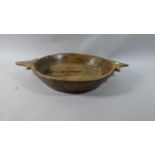 A Tribal Carved Wooden Two Handled Bowl, 36cm Diameter