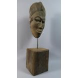 A Carved Wooden Tribal Mask Mounted on Rectangular Wooden Plinth, Total Height 51cm