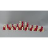 A Marine Ivory Red and White Chess Set, the Kings 10cm High