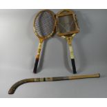 Two Vintage Tennis Rackets and a Hockey Stick