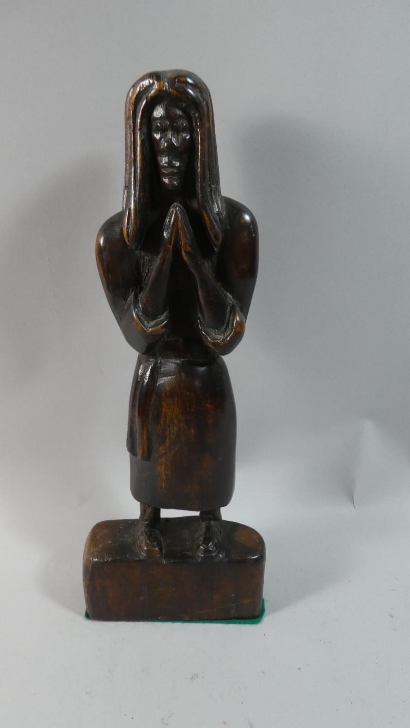 A Carved Wooden Tribal Figure of Standing Man Praying, 35cm High