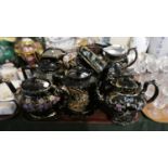 A Tray Containing Various Jackfield Style Teapots and Jugs with Multi Coloured Enamel Decoration