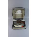 A Vintage Brother Deluxe 1350 Portable Typewriter in Canvas Bag