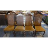 A Set of Eight Cane Backed Dining Chairs to Include Two Carvers