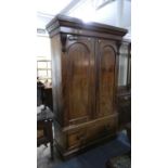 A Late Victorian Mahogany Wardrobe with Base Drawer and Panel Doors to Hanging Compartment and