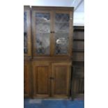 A Mid 20th Century Lead Glazed Library Bookcase with Crossbanded Panelled Doors to Cupboard Base,