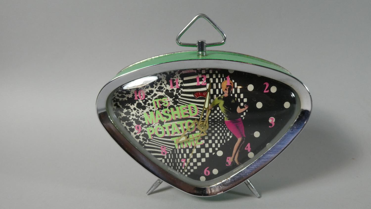 A 1960's Vintage Alarm Clock of Triangular Form the Dial Decorated with Dancing Girl and