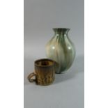 A St Ives Stoneware Cup, 7cm High Together with a Glazed Holkham Vase, 17.5cm High