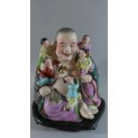 A Large Glazed Oriental Ceramic Laughing Buddha with Five Attendants on Wooden Stand, 33cm High