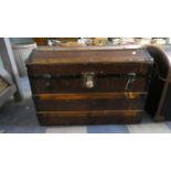 A Dome Topped Metal and Canvas Mounted Travelling Trunk, 77cm Long