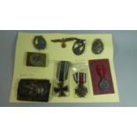 A Collection of Various WWII Nazi Badges to Include Three Combat Medals, Wound Medal, WWI Iron