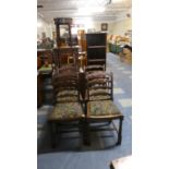 A Set of Four Oak Framed Ladder Back Dining Chairs with Tapestry Back Seats