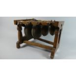 A Vintage Black Forest Percussion Instrument in the Form of Four Graduated Cow Bells Suspended on