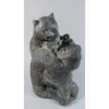 A Carved Inuit Stone Study of Eskimo Fighting Polar Bear, 31cm High