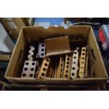 A Box Containing Various Treen Pipe Racks and Stands