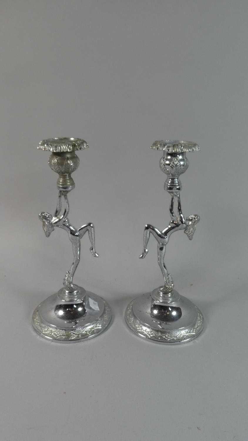 A Pair of Mid 20th Century Chromed Candle Sticks in the Form of Nudes, 22.5cm High