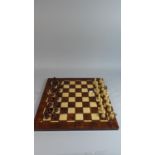 A Wooden Chess Board and Set of Chess Men