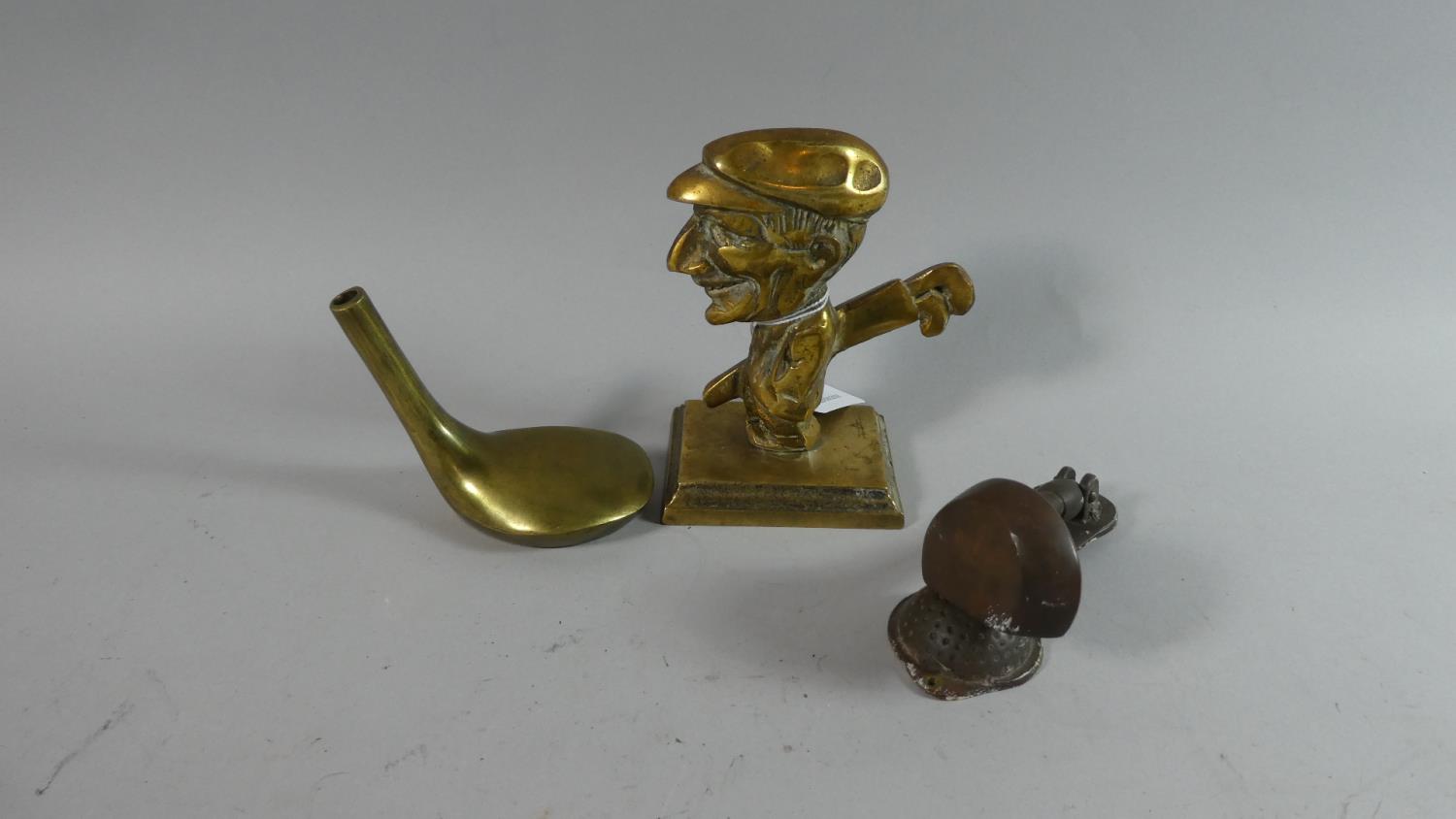 A Brass Novelty Paperweight in the Form of a Caricature Golfer, a Door Knocker in the Form of a Golf