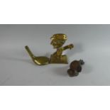 A Brass Novelty Paperweight in the Form of a Caricature Golfer, a Door Knocker in the Form of a Golf