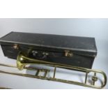 A Brass Corton Trombone in Case