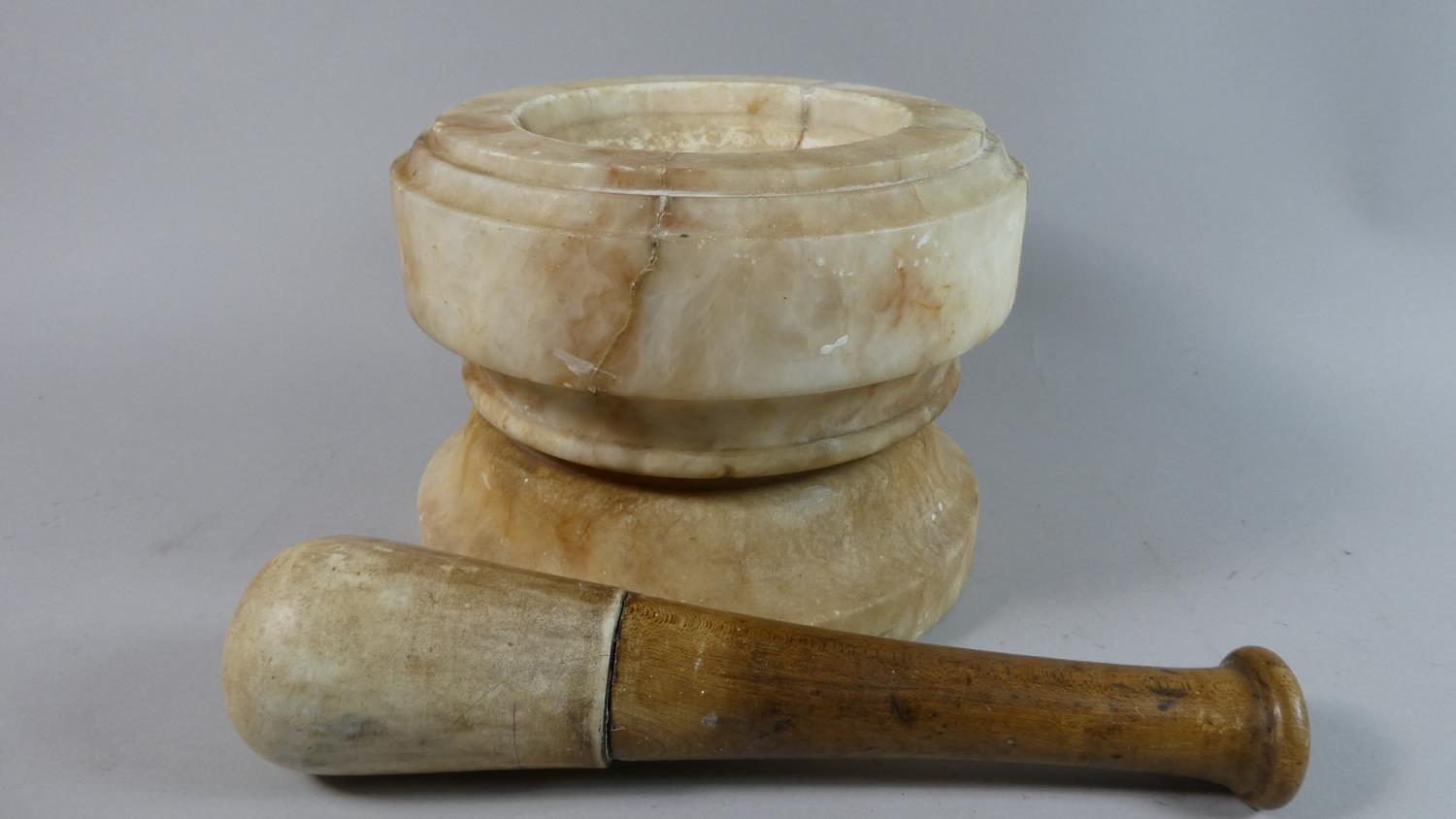 An Early Alabaster Font, 19.5cm Diameter and 14.5cm High Complete with Unrelated Wooden Handled