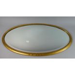 An Edwardian Gilt Framed Oval Wall Mirror with Bevelled Glass, 70cm Wide