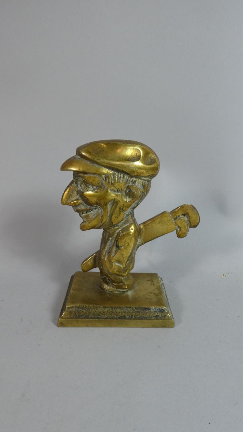 A Brass Novelty Paperweight in the Form of a Caricature Golfer, a Door Knocker in the Form of a Golf - Image 4 of 4