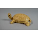 A Carved Wooden Netsuke in the Form of a Tortoise, 6.5cm Wide