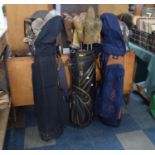 Three Golf Bags Containing Various Golf Clubs