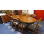 A Crossbanded Burr Wood Dining Room Suite Comprising Side Board, Oval Extending Dining Table and
