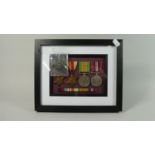 A Collection of WWII Medals Together with a Royal Artillery Cap Badge